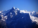 Kathmandu Mountain Flight 04-1 Gauri Shankar Wide View The twin summits of sacred Gauri Shankar and the step south face are clearly visible on the Kathmandu mountain flight. The higher northern summit (7134m) of Gauri Shankar is called Shankar, a manifestation of Shiva, and the lower southern summit (7010m) is called Gauri, a manifestation of Shiva's consort. Gauri Shankar has only been climbed a few times because of its extremely difficult steep faces and long, corniced ridges.